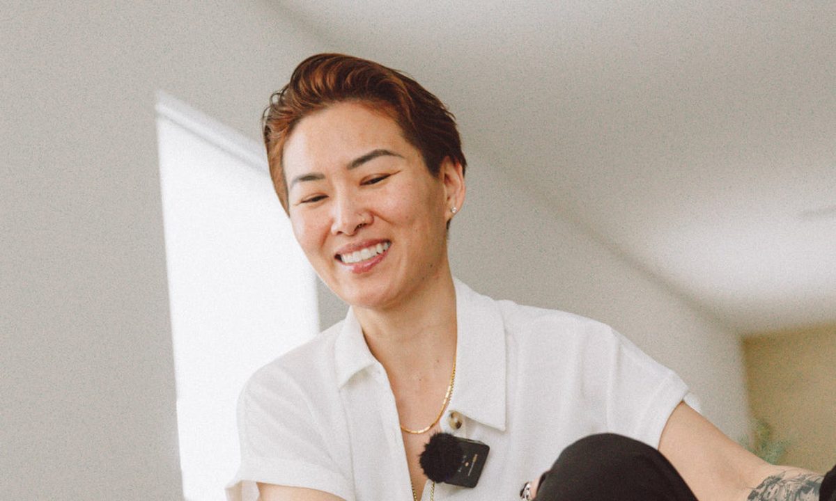 Angie Wong smiling during a hands-on treatment
